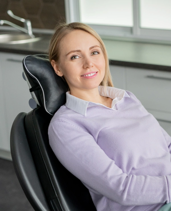 Woman receiving a dental cleaning and exam