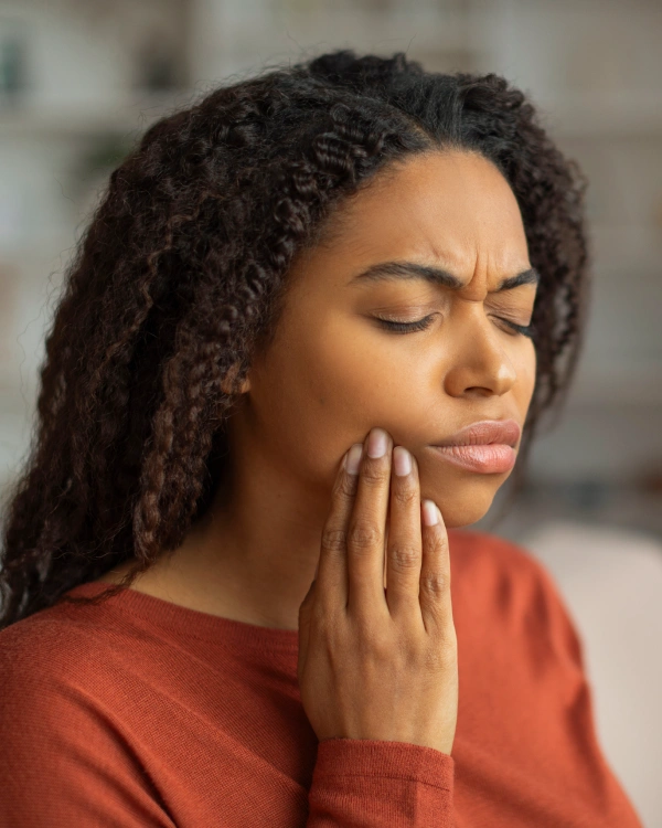 Woman experiencing tooth pain