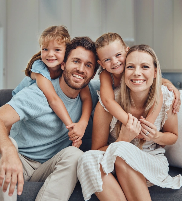 Family smiling together for general dentistry