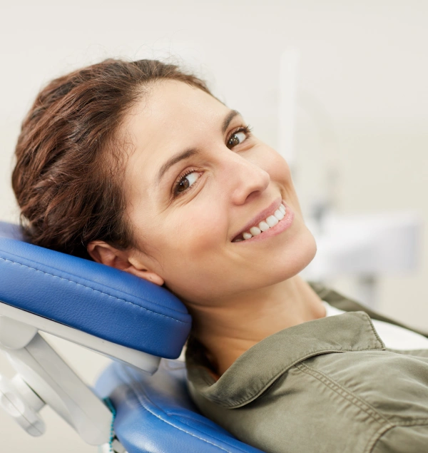 Smiling dental patient in a treatment chair
