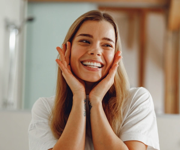 Smiling woman representing patient forms
