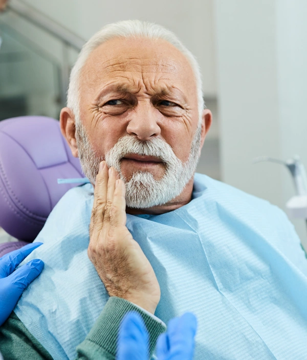 Older man experiencing tooth pain